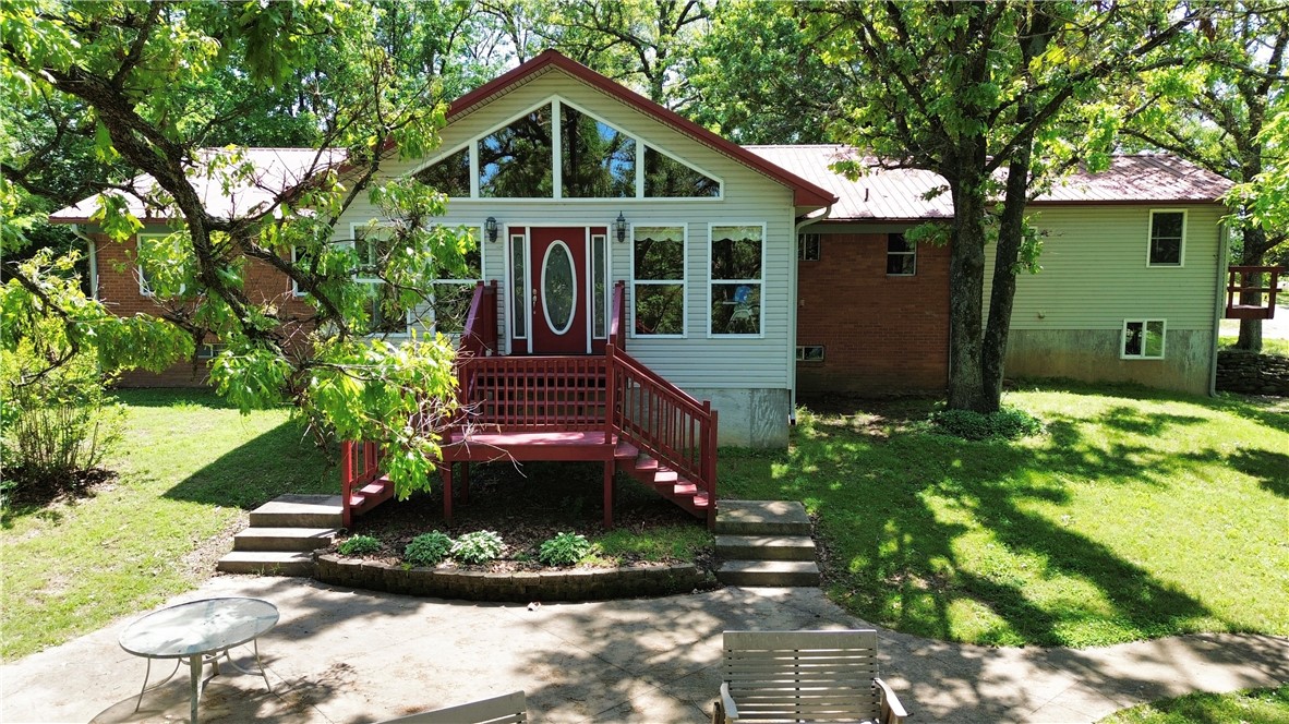 Easy commute, rare opportunity, come see this property!! **Sellers to provide a $5,000 seller concession at closing**Beautiful park like setting on 2 acres m/l sprinkled with mature trees surrounding a prime multigenerational opportunity just under 5 miles from Huntsville! This expansive home boasts 7 beds/4.5 baths total, 4/4 upstairs, featuring a great layout with elevated front-yard views. 20X30 metal storage building. The real bonus is the versatile lower level with its own private garage access, approx 1462 sq ft great for a dual-living suite, mortgage helper, or income-generating rental. Discover endless possibilities for income and flexible use—come see it today! 
Great location off of hwy 74 for easy commuting all over NWA!!!