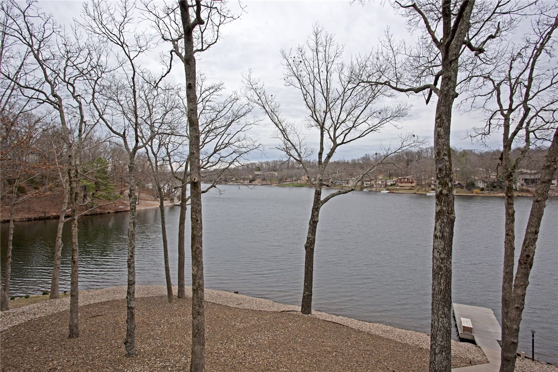 Best location on Lake Avalon with mesmerizing views. Only 15 yards on a paved sidewalk to your own private dock. Completely remodeled home including new septic and HVAC. Home boasts 4 bedrooms and 3 full baths, lower level bedroom is also used as a living room with French doors that walk out to patio. Indoor workshop and storage rooms. Underneath has been completely encapsulated in painted concrete. Ready for your summer enjoyment. Come see this amazing property, you wont be disappointed.