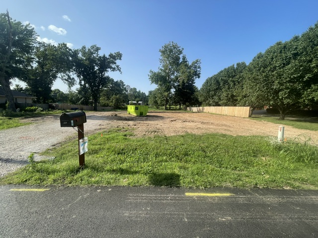Looking for the perfect lot to build your dream home? This lot is close to the Bentonville Square, right on the Greenway and within a bike ride to Coler Mt. Bike Trails.  This .59 acres is cleared and surveyed and level with a slight slope to the back ready for your next build. Don't mis this opportunity. Lot is vacant .