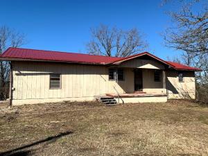 Ranch style home with large yard placed on approximately 23 acres m/l of beautiful Ozark land. Nicely centered in the country with a short drive in any direction to your choice of activities. Branson & shopping to the NW, east is Bull Shoals Lake with boating, area hiking, golfing and so much more. Updated floors in most of the house.