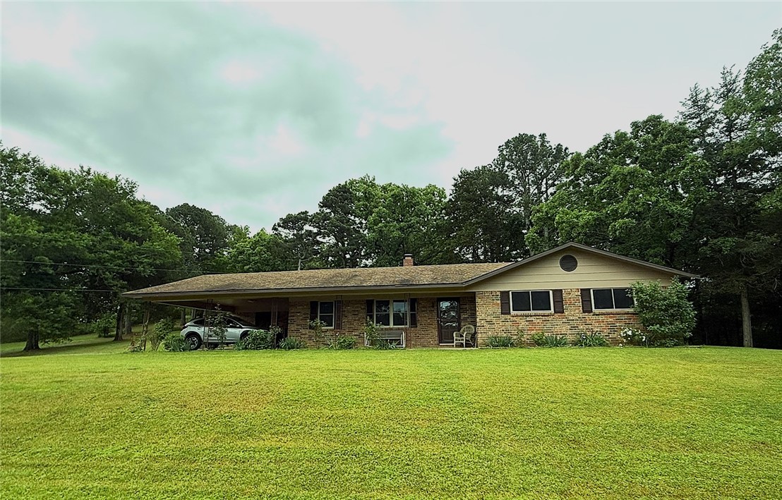 This charming 3-bedroom, 1.5-bath home offers the perfect blend of comfort and space, situated on a beautiful 1-acre lot. Freshly updated with new paint and brand-new flooring throughout, the home feels bright, clean, and move-in ready. Step outside and enjoy the wide-open space—ideal for gardening, entertaining, pets, or simply relaxing in the peaceful surroundings. A separate storage building provides excellent space for tools, hobbies, or additional storage needs.