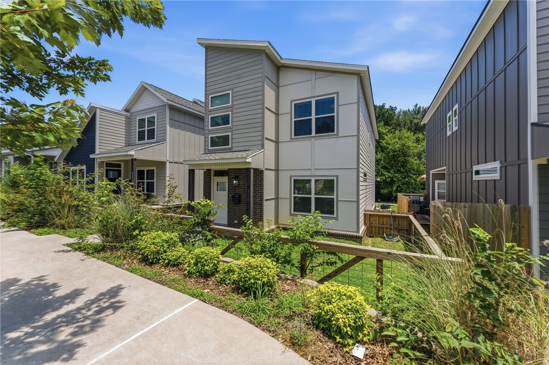 Conveniently located near MLK & school Ave. Modern amenities, luxury vinyl plank in main living areas, high ceilings, & open floor plan. Features eat-in kitchen with pantry, stainless appliances, granite countertops, & office on first floor. Second floor has laundry room, large primary bedroom with LVP, large walk-in closet & full bath, & additional carpeted bedrooms. Exterior has covered patio & 2 car parking. Near shopping, restaurants, parks, & trails.
