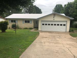 Are you looking for that house with the large yard for your kids or your furbaby? This 3 BR 2 BA home is on corner lot that is a 1/4 acre. It has an open concept kitchen, dining room, living room and amazing sun room. The sun room and entryway have brand new Pergo laminate flooring. There is fresh paint, newer triple pane windows, an updated master bathroom, a huge fenced in back yard and a metal roof. All in a great neighborhood.