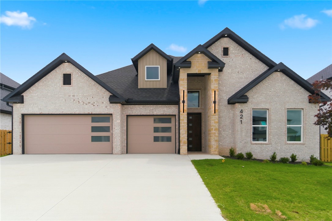 This beautifully designed 4-bedroom home features engineered hardwood flooring throughout the main living areas, tile in all wet areas, and carpet in the bedrooms. The kitchen offers quartz countertops, a custom tile backsplash, floor-to-ceiling cabinetry with glass uppers, and an oversized island. The living room and foyer feature impressive 14-foot ceilings, while the remaining areas offer 10-foot ceilings, 8-foot doors, and oversized 6-foot windows for abundant natural light. The primary suite includes a fully tiled shower, while secondary baths feature tiled surrounds.