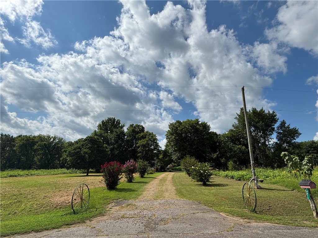 Peace and privacy of country living on 9 acres with NO RESTRICTIONS!  This quiet property features a three bedroom and two bath mobile home with a spacious layout, including a large kitchen and eat in dining that is perfect for gathering with family and friends.  Outside you will find a large well maintained garden.   This property is served by a private well and offers an endless supply of water.  With no restrictions making this property ideal for livestock, additional buildings, recreational use, or simply enjoying the freedom of country living.  If you're looking for a full time residence, hobby farm or just a peaceful rural retreat this property offers space, flexibility and opportunity.