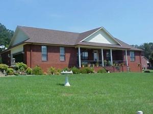 ALL BRICK HOME ON 1.88 acres in Prestigious Bayview Hills/Piney Bay area with boat dock rights.  Home has open floor plan, beautifully decorated and landscaped.  Real hardwood floors in living, dining and hallway, tile in kitchen and baths. Brick matching mailbox, security system, storm cellar and, along with heat pump, also has propane backup ventless heater and transfer switch so if power is out, flip switch and power is running.  Low maintenance home, immaculate inside and out.  Move in ready, home has gutters all around, custom wood plantation blinds and great room with formal drapes and sheers.  Tray ceiling in master bedroom, walk in plus 2 addl closets.  Great room 24x36 with vaulted ceiling.  Detached matching garage besides 2 car attached and so much more.  Call for appointment.