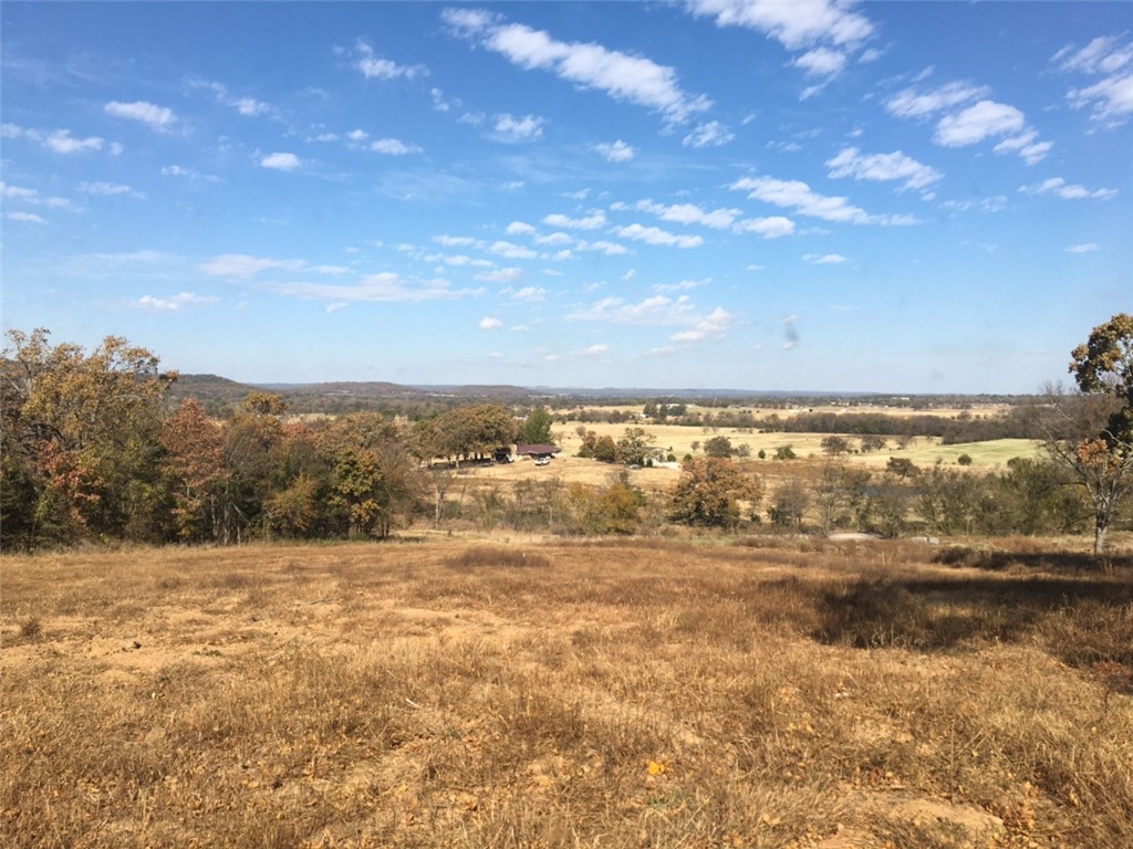 6.4 Acres! This piece of land has two or three good building spots with beautiful views of Prairie Grove valley.  Great location to get easily to main roads. Agent owned