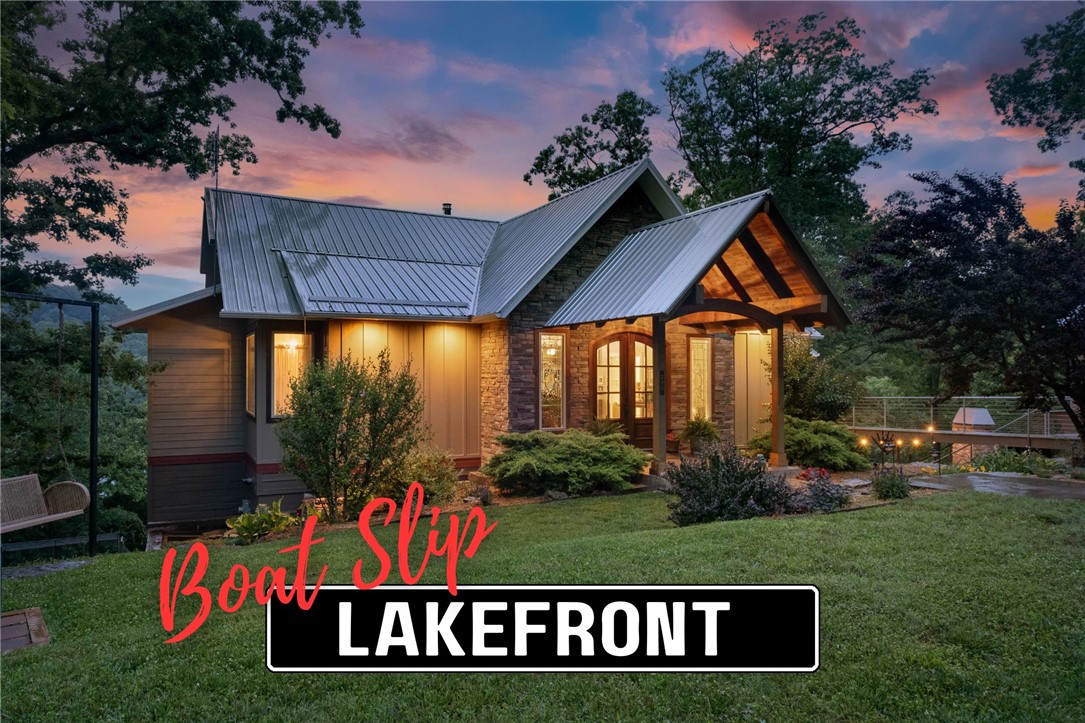 This custom-built lakefront estate offers panoramic Beaver Lake views, quality craftsmanship, and a waterfront lifestyle that's increasingly difficult to find. Located in a gated community, a concrete driveway leads all the way to the property. Whitewashed pine beams, Georgia long-leaf pine floors, a floor-to-ceiling stone fireplace, and walls of windows highlight the family room. The main level features a luxurious owner's suite, office, and half bath. Designed with entertaining in mind, the kitchen boasts granite countertops, an oversized island, and an enormous walk-in pantry. Family and guests will appreciate the walk-out lower level with two bedrooms, each with its own bath, and a bonus room. Outdoor living includes an upper deck, screened-in porch, fireside gathering area overlooking the lake, and a lakeside sitting area. The cove is ideal for swimming and floating near the shoreline rocks, while the boat slip is located just down the street. A rare offering that captures the very best of Beaver Lake living.
