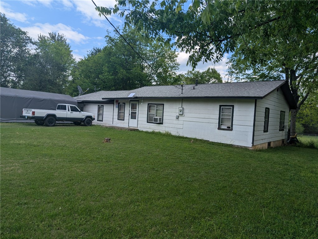 Enjoy country-style living on this 1-acre property featuring a 3-bedroom, 2-bath home with plenty of space inside and out. The large yard offers room for outdoor entertaining, hobbies, or expansion with a wet weather creek just beyond the chain link fence. With some updates and improvements, this home can truly shine. A great opportunity for buyers looking for space, privacy, and the chance to make it their own.