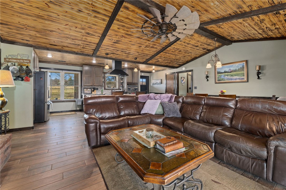 10 Acre homestead just minutes from Prairie Grove offering the perfect blend of modern comfort & country living. This 4BR/3BA-1,968 SF home was taken down to the studs in 2018 & completely rebuilt w/new electrical, plumbing, windows & insulation, plus a new roof added in 2022. Inside, you'll fall in love w/the burnt tongue & groove cathedral ceiling w/exposed beams, & wood-look ceramic tile flooring throughout. The kitchen has a gas cooktop, granite countertops, & a hammered copper farmhouse sink. Outside, the 40x60 barn features built-in pipe bale feeder, stalls, & two sliding equipment doors. The 30x50 shop has a concrete floor, 220 wiring, sliding equipment doors, & a walk-through door. The land has breathtaking mountain views, well-established grass, & holding pens w/head chutes. The property is completely fenced & cross-fenced. The large pond w/established fish is perfect for relaxing evenings or family fun. This is a rare opportunity to own a turnkey homestead in an incredible location. Don't miss it!