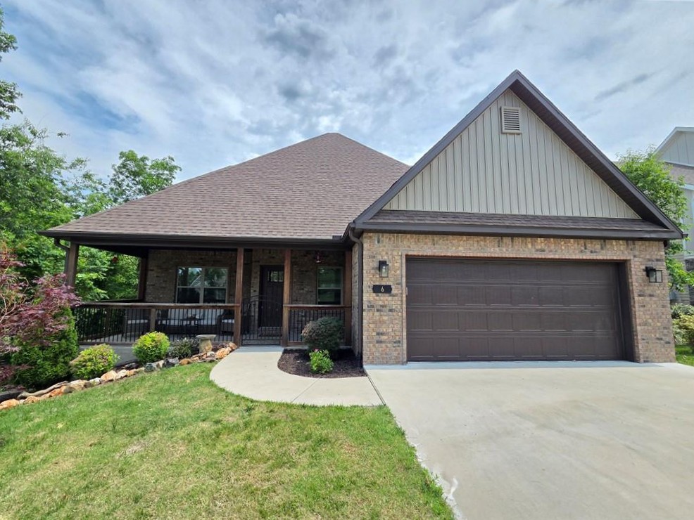 Envision your future in this exquisite residence, boasting an expansive private front porch, complemented by a custom wrought iron fence, providing a serene retreat. The interior showcases bright living spaces with recent updates, including fresh paint, LVP flooring on the main level, and new carpeting upstairs. A stunning stone gas log fireplace serves as a focal point, while the functional kitchen features soft-close cabinetry, granite countertops, an island, under-cabinet lighting, a gas cooktop, stainless steel appliances and ample storage. The master suite offers a spacious walk-in shower, dual vanity, soaking tub, and generous walk-in closet. Three generously sized bedrooms with walk-in closets and a full bath are situated on the upper level. Additional amenities include dual Ecobee thermostats, a back deck with an electric Sunsetter awning, a heated oversized garage with a drop-down workbench, storage throughout the home and in the large crawlspace, and a beautifully landscaped yard on a cul-de-sac street.