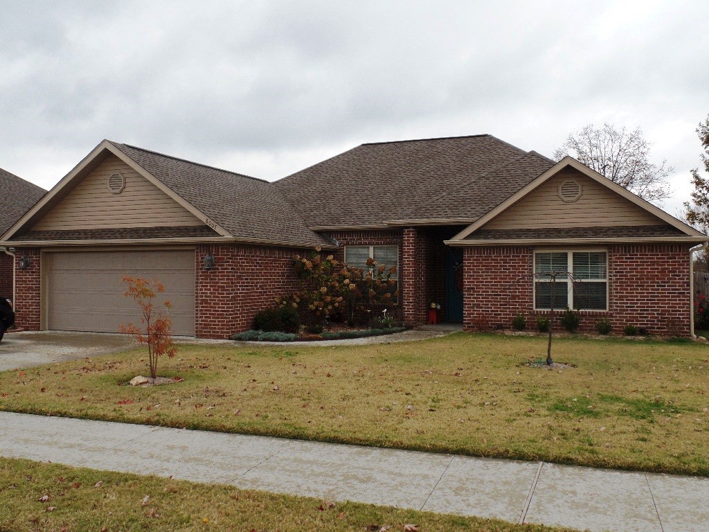 Better than new! Custom built home with approx. 2000 sf. The formal dining room has pocket doors to easily leave open or close off for privacy. Open floor plan, kitchen has granite counter tops, lots of cupboards and open eating area. Living room features gas log fireplace. Tile and wood flooring thru-out home.  A very nice 4 bedroom plan! Lovely landscaping, covered patio, wood privacy fence, gutters and storm shelter built in the floor in the garage!  Easy to show!
