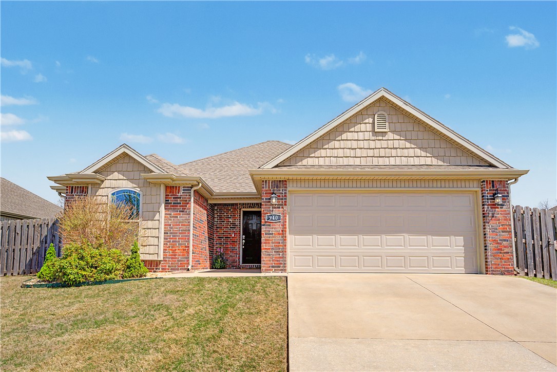 This beautifully updated home in the desirable Briar Rose subdivision features a private backyard with a covered patio, fully fenced yard & no direct neighbors behind the property. Refreshed throughout, this home offers LVP flooring in the living room, new carpet in the bedrooms, new blinds, new fixtures & a full interior repaint, including trim, cabinets, doors. The open-concept floor plan is highlighted by arched hallways, crown molding & an abundance of natural light. The living room has a gas fireplace with a built-in niche above, creating a perfect focal point. The kitchen features granite counters, white cabinets, stainless steel appliances, a bar-top opening to the living room & dining area. The primary bedroom provides a tray ceiling, crown molding & plenty of room to unwind.  The spacious primary ensuite features dual vanities & two separate walk-in closets. Conveniently located within walking distance to Bentonville West High School & Gamble Elementary. $3,000 Preferred Lender credit (terms apply).