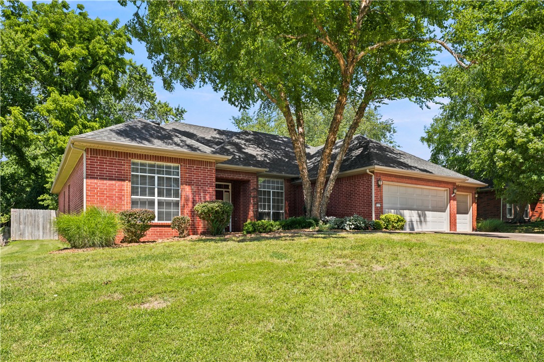 Location! Location! Location! View this unique, well-built brick Fayetteville residence with close proximity to the University of Arkansas, Downtown Fayetteville, Lake Fayetteville, the Botanical Gardens of the Ozarks, shopping areas and fine dining. This inviting home includes 4 bedrooms, 3 full bathrooms, a 3-car garage and features a split floor plan! The 12-foot living room ceilings are decorated with crown molding and the large oversized windows allows in the natural light creating an inviting open space to the outdoors. The large eat in kitchen has a built-in pantry, extra storage, breakfast bar, and opens directly to the oversized outdoor patio. Other amenities include master bedroom with ensuite, Jack-n-Jill bathroom, recirculating hot water system, a peaceful, park-like, privately fenced landscaped back yard with irrigation system that helps ease any outdoor yard watering.