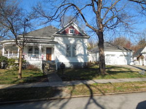 WOW. If you like historic homes, you will love this home which has been restored, and updated. This home features wrap around porch, beautiful hardwoods, staircase from the spacious foyer, large kitchen, master bedroom on the main floor plus 2 (could be 3) more on the second floor,plus den. Nice office, and large 2 car attached garage, as well as a detached garage. SEE MORE...