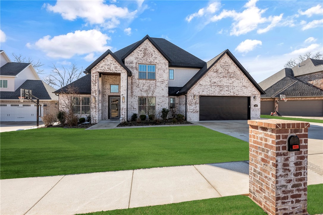 Welcome to this breathtaking 4-bedroom, 3.5-bathroom home, where luxury and comfort meet. Located in desirable Oak Tree S/D, this property offers an open-concept floor plan with high ceilings, elegant finishes, and an abundance of natural light. The chef’s kitchen features top-of-the-line stainless steel appliances, custom cabinetry, quartz countertops, and a large center island with prep sink. The spacious primary suite offers a serene retreat with a spa-like ensuite bath, featuring a soaking tub, dual vanities, and a walk-in shower. The additional three bedrooms are generously sized, with ample closet space and access to private bathrooms. Outside, enjoy your private backyard oasis—a beautifully landscaped space with a sparkling in-ground pool w/sunning shelf, spacious patio, and room for outdoor entertaining. Additional highlights include cozy fireplaces, hardwood floors, an oversized 3-car garage, and a prime location close to everything NWA has to offer. This home is a rare gem—schedule your showing today!