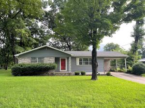 Cute 3 bedroom, 2 full bath home nestled in the quiet and cozy Pine Hill Subdivision. Within minutes from all the things town has to offer, you still feel tucked away from the hustle and bustle.  Large back deck for entertaining and hosting BBQ's, charming outbuilding for additional storage, and a great privacy fenced back yard for activities for all ages!