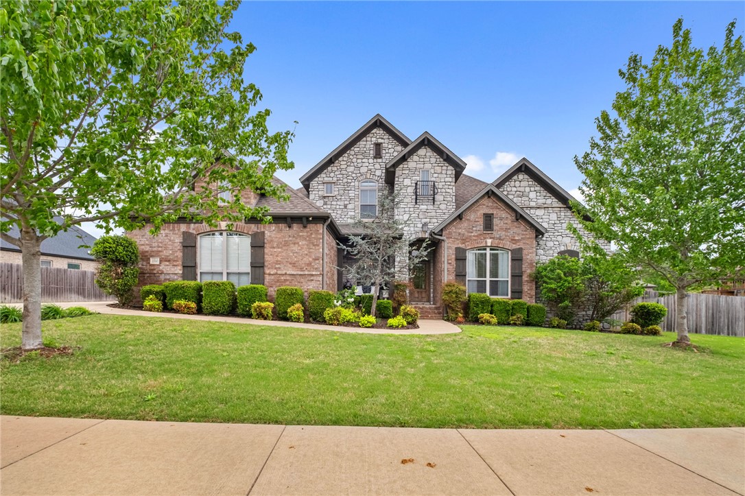 Built by Buffington in 2018 and located in the popular Lexington subdivision, this charming home offers a thoughtfully designed layout that reflects quality craftmanship throughout. The main level features an open concept design filled with natural light, 10-foot ceilings, and detailed trim work that creates a warm, polished feel. With 4 bedrooms (including 3 on the main level), 3.5 baths, two living areas, and a versatile flex space or office, there’s plenty of room to live and entertain! The spacious primary suite is privately situated on the main level and features a bay window sitting area along with a large en-suite bath. The kitchen serves as the heart of the home, showcasing a large island, granite countertops, and ample storage, all seamlessly open to the main living area. Additional highlights include a 3-car garage, covered patio, and generous storage throughout. Conveniently located in the Bentonville School District, just minutes from Bentonville West High School and the Walmart Home Office.