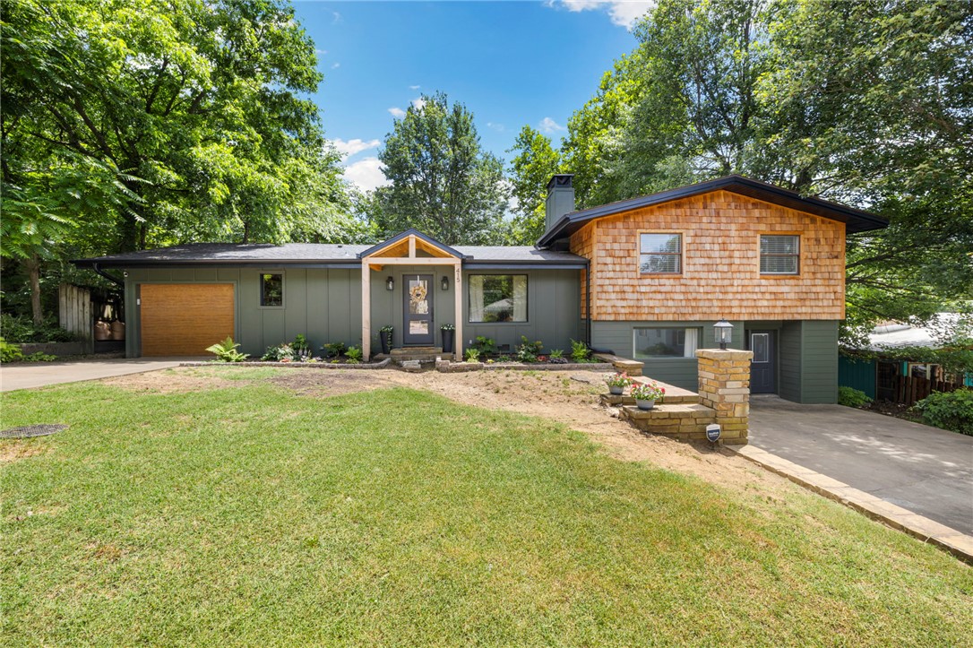 Charming 1960s home, fully renovated and move-in ready in one of Fayetteville's most walkable locations — minutes to Wilson Park, Downtown, and nearby trails. Inside, a new open-concept kitchen flows into the living room, with the added convenience of a walk-in pantry and mudroom. Outside, a new deck, retaining wall, and fresh grading complement a completely refreshed exterior — new siding, cedar shingles, and soffits throughout. Too many updates to list. Come see it for yourself.