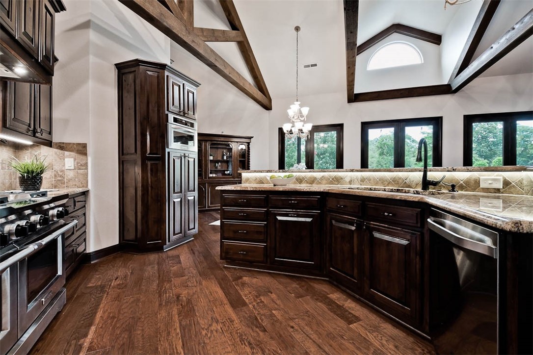 Outstanding home located in desirable area near Sassafras Winery/vineyards on professionally landscaped, quiet 2 acres with an in-ground salt water pool in Bridlewood Subdivision.  This unique, one-of-a kind home with large picturesque windows from every room provides a peaceful, tranquil feeling as if you are enjoying the outdoors year round! The Large kitchen opens to the living room and breakfast area. The living room features built-ins and a wood burning fireplace.   With Ceilings and beautiful wood beams, this home boasts of character.  The "fifth" bedroom is a studio apartment equipped with full kitchen, full bath, and washer/dryer connections.  A 3-car garage is attached to home by a gated breeze way.  Additionally, a detached "Car House" with 5 overhead garage doors provides 7 floor car spaces. With 5 power lifts, this garage easily stores 12 vehicles. This "Car House" has many additional features including a loft and 1/2 bath for the ultimate "man cave". Call to access a list of additional features.