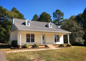 You'll fall in love the moment you pull up to this lovely home with its charming front porch and big bright windows!  Set on 3.74 country acres, this 3 bedroom, 2 1/2 bath home has so much to offer with a spacious open living room with a cozy fireplace, nice master suite on the main floor with a private bath and walk in closet, and 2 roomy bedrooms and a full bath upstairs!  Outside you'll enjoy the private patio and room to roam that this lovely property has to offer.  All this in a location that is rural but not remote with just a short drive to I-40 and Russellville!