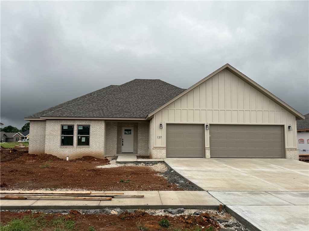 Beautiful new-construction home with thoughtfully designed interior spaces. Step inside to an open, airy layout featuring wood-look tile flooring, recessed lighting, and a stunning fireplace that anchors the spacious living room. The kitchen shines with white cabinetry, soft-close doors and drawers, quartz countertops, stainless steel appliances, gas range, under-cabinet lighting, and a large island with seating—perfect for everyday living or entertaining. The private primary suite is a true retreat with a tray ceiling, ceiling fan, spa-inspired bath featuring a fully tiled walk-in shower with glass enclosure, soaking tub, and dual-sink vanity. Secondary bedrooms are well-sized with ample closet space. Enjoy the covered entry, full fencing, gutters, blinds, and energy-efficient construction. Located in a growing neighborhood with easy access to parks, schools, and local amenities—this move-in ready home checks all the boxes.