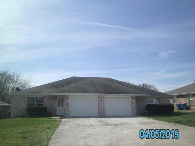 located just north of Bentonville square is this income producing duplex. 2 bedroom 2 bath duplex with 1 car garage each side