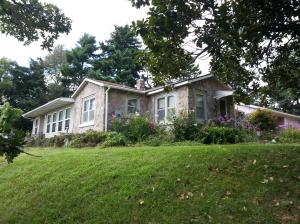 Home with a view and Hwy 62-65 frontage! This place has a lot to offer with over 3 acres, 30x40 shop building, 10x12 building, sun room with Pella windows, hardwood flooring, tankless water heater, walk in closets, lots of storage, and more! Could be a great place for a home business!