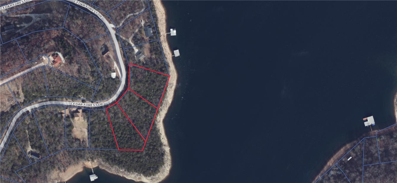 Your perfect slice of Beaver Lake life awaits YOU on the North end near Point 4!  This 1.06 acre Lot nestled in the peaceful surroundings of Cedar Forest Subdivision is a gently sloping, wooded parcel offering the perfect blend of privacy and natural beauty, making it ideal for a custom home, vacation retreat or investment opportunity.    This plat offers seclusion with breathtaking panoramic views  located close to shore for an easy walk to the water and is an ideal canvas for your dream home with generous land to store your RV, water toys, and even plant your own homegrown garden.  Paved road access  Cedar Forest is minutes to Lost Bridge Village, Marina and all the amenities.   There is an  airstrip minutes away or take a short drive to Bentonville, Rogers or Eureka Springs, for  dining, shopping and entertainment while still enjoying a quiet lake lifestyle.  Rare opportunity to own over an acre on the shore line   Perc test has been completed