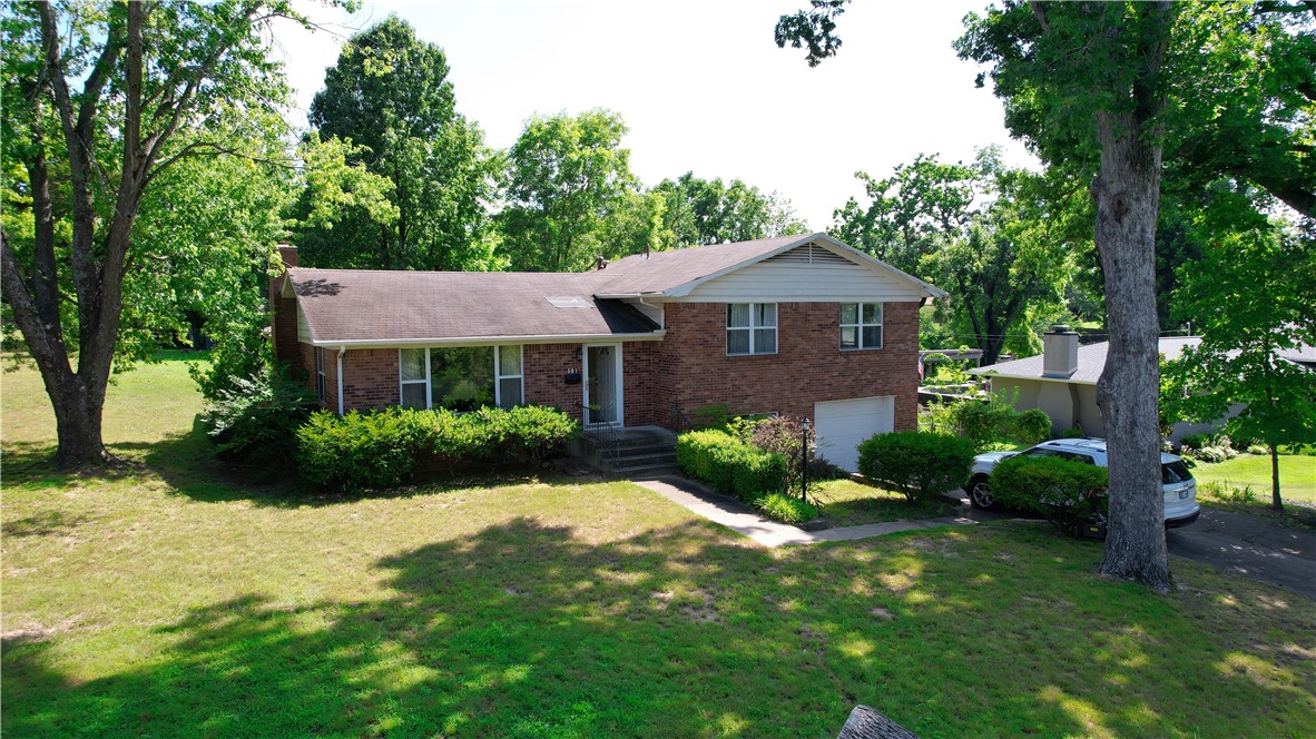 Downtown Bentonville Opportunity!! Rarely does a one owner property like this become available in one of Northwest Arkansas' most sought-after locations. Situated on an exceptional 0.60-acre corner lot in the Bentonville downtown district, this property offers endless possibilities. Renovate the existing home, create your dream residence, or explore the potential of this oversized homesite in an area where larger corner lots are increasingly rare. Enjoy easy access to world-class bike trails, Park Springs park, top-rated schools, Crystal Bridges Museum of American Art, the Bentonville Square, premier dining, shopping, entertainment, and everything that makes downtown Bentonville one of the nation's most desirable places to live. Whether you're seeking a forever home, a luxury homesite, or a prime investment opportunity, this exceptional property offers location, space, and unlimited potential. This home is being sold as is.