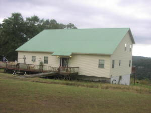 Nice views from this large, well maintained, three bedroom 2 1/2 bath home on 15.63 acres. Close to Jasper and the Buffalo National River. Easy access and private. Large semi-finished walk-out basement with lots of storage space. Metal roof, electricity and rural water. Large rooms and an office area. Some appliances will remain. 500 gallon owned propane tank. Above ground pool.