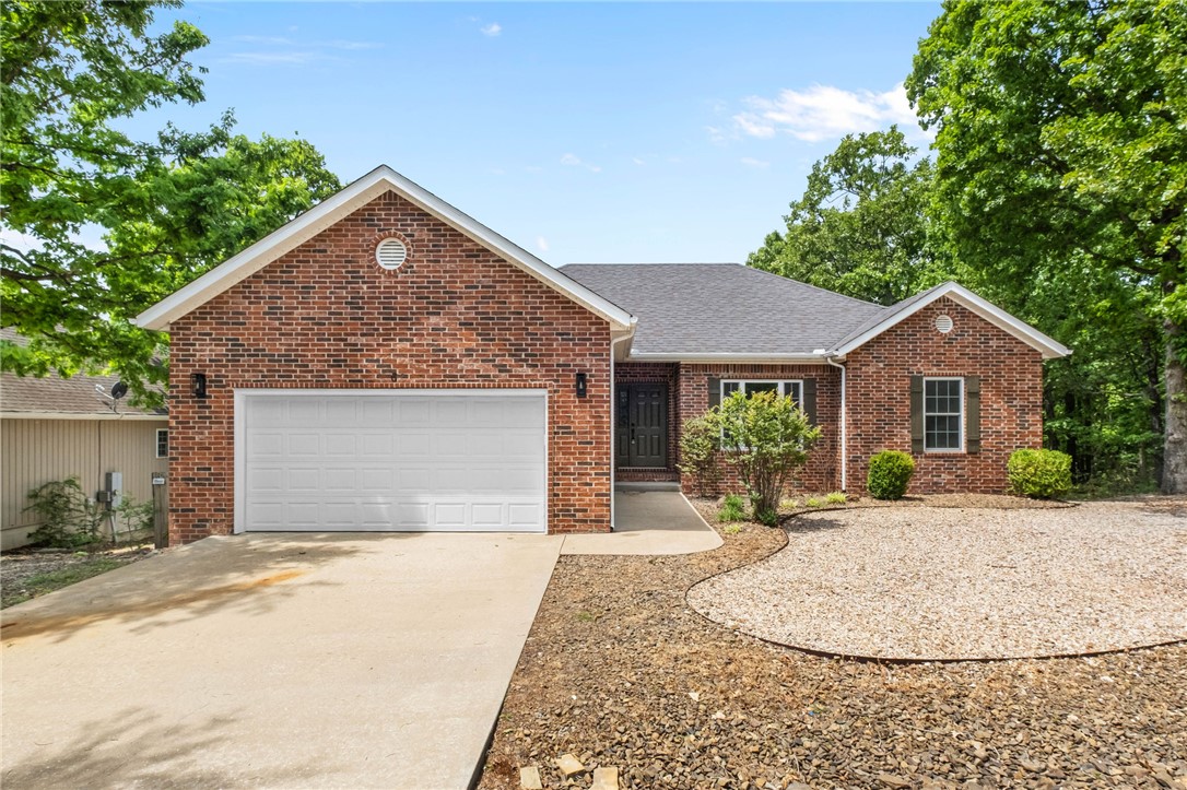 Come home to this newly updated Bella Vista home featuring 3 bedrooms and an office.  Just around the corner from multiple bike trails and minutes away from Lake Ann and Lake Brittany. The home features a large open living space, large fenced yard and a large deck. Recent updates including paint throughout, Refinished hardwood floors in the entry, living room and kitchen, brand new carpet in all three bedrooms and the office, quartz counter tops, reinforced and freshly painted deck and stairs, remodeled bathrooms, new cabinet hardware, all new electrical outlets, switches and lighting, all new stainless steel appliances. Roof was replaced in 2018. HVAC was replaced in 2022. Septic tank pumped and serviced in May 2025.