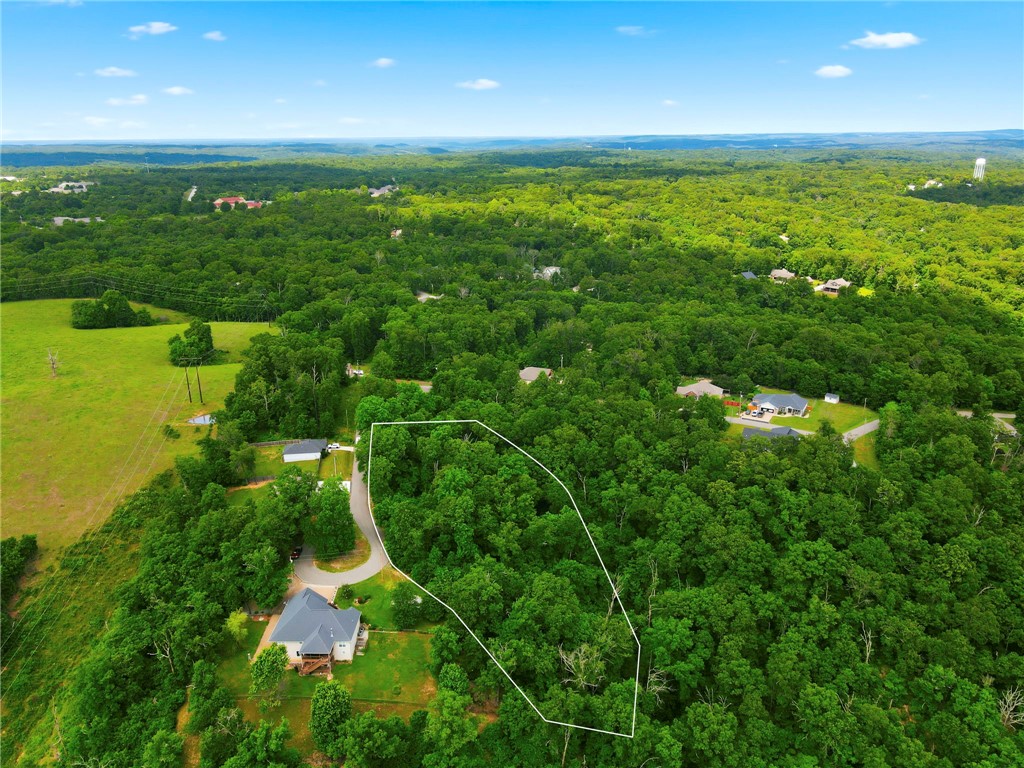 Rare 1.46-Acre Wooded Lot on Charlene Lane in Bella Vista's west side!
Build your dream home or private woodland estate on this exceptional 1.46-acre residential parcel. Offering an expansive, park-like footprint that is truly a rare find in the area, this property provides the perfect blend of natural privacy and convenient accessibility.
The beautifully wooded landscape features dynamic terrain ideal for a custom architectural masterpiece, a modern multi-tiered layout, or a private homestead with room to breathe.
Enjoy the world-class amenities that define Bella Vista—including championship golf courses, pristine recreational lakes, and miles of premier mountain biking and hiking trails. You get all the quiet perks of a hidden mountain hollow while remaining just a short drive from the dining, shopping, and corporate hubs of nearby Bentonville.
A unique large-acreage opportunity in a rapidly growing region. Drive by and see the property today!