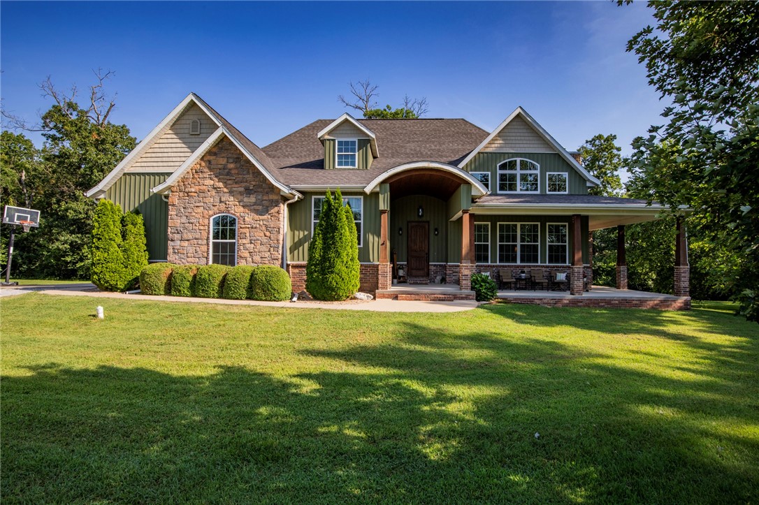 Welcome to your dream retreat! Nestled on 10+ serene acres, this stunning property offers the perfect blend of privacy, functionality, and proximity to all that Northwest Arkansas has to offer. The home features beautiful hardwood floors throughout and a smart, spacious layout with 3 bedrooms, 2 bathrooms, a dedicated office, and a versatile bonus room—ideal for modern living.

Step outside to enjoy the incredible 40x80 dream shop, fully equipped with electric, plumbing, and even a half bath—perfect for hobbies, storage, or running a business. The picturesque country setting offers peace and quiet, while still being just minutes from town. Imagine relaxing on the expansive front porch, soaking in the views and the tranquility of your own private paradise.