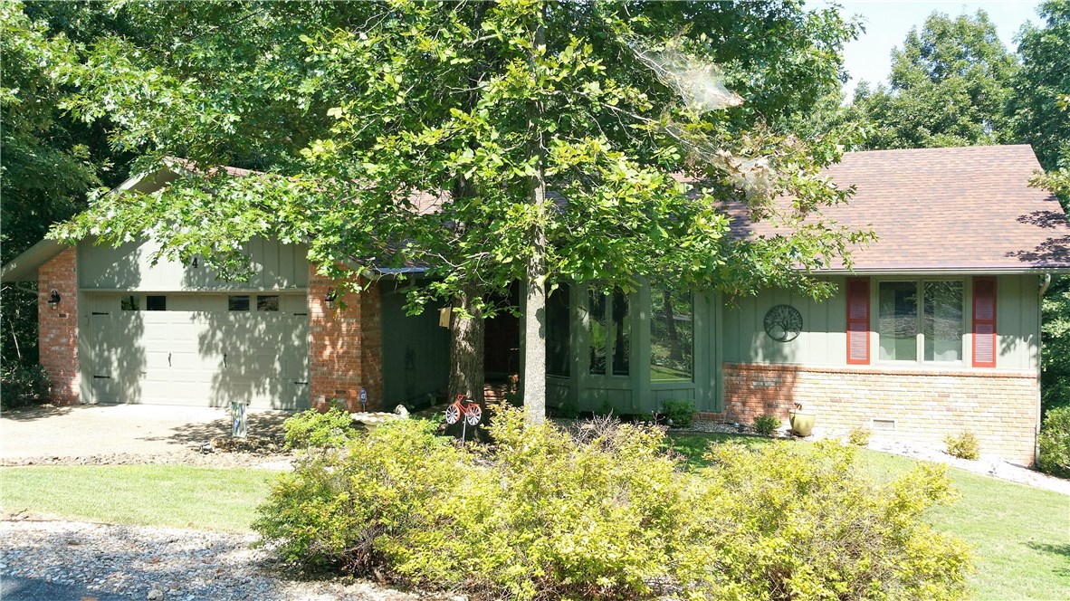 What a Jewel! Totally updated Highlands home, vaulted ceilings, floor to ceiling bookcases, Anderson windows, Cherry finish cabinets with exotic granite in Kitchen, bay window in breakfast, new granite in bathrooms, hand scraped hardwood throughout house, carpet in the  spacious master bedroom, huge master closet, glazed cabinetry in master bath, new roof 2010, 16x11 workshop. Screened back deck has stunning antique screen door, separate grilling deck. Beautiful wooded view from the deck.