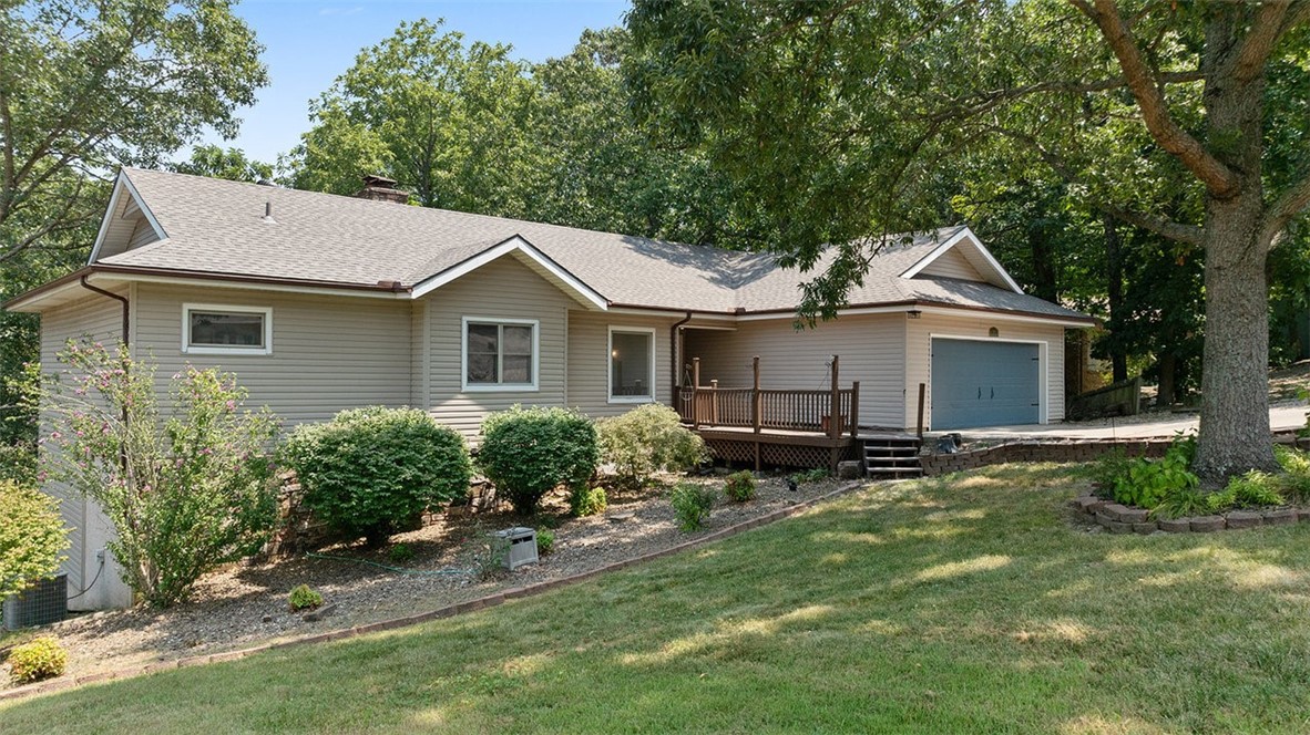 Packed with potential, this 3-bed, 3.5-bath Bella Vista ranch offers 2,678 sq ft of flexible living space on a beautifully landscaped half-acre lot. With two fireplaces, two living areas, and two decks, there's room to relax, entertain, and spread out. Recent updates include a brand-new roof, new lower-level HVAC, fresh paint, new tile, carpet, lighting, fixtures, and quartz and granite counters throughout. The lower level features two bonus spaces — one with outdoor access perfect for a workshop, gym, art studio, game room, or 4th bedroom. The smaller bonus room would make a lovely office or theater room. There's even short-term rental potential. A two-car garage and finished basement, round out this incredibly versatile home. Community amenities include a clubhouse, tennis courts, and playground, all just minutes from Loch Lomond marina, the K-9 park, and Scottsdale Golf Course. Come see everything this home has to offer!