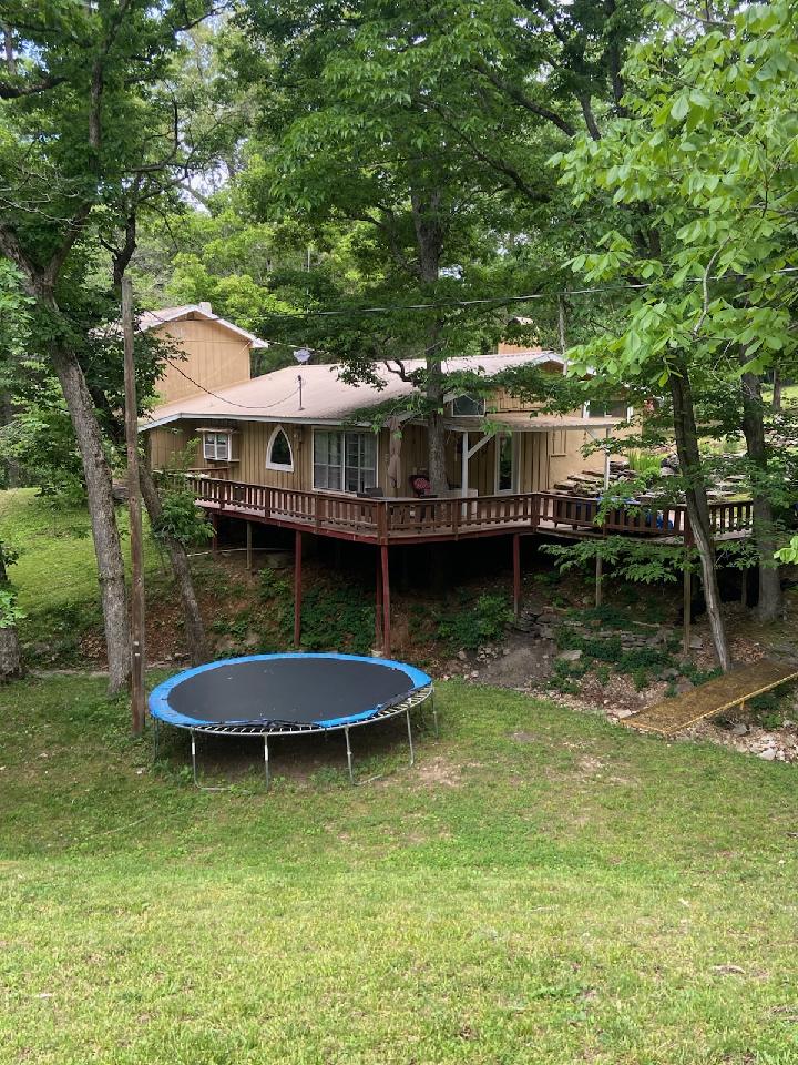Set in a serene, park-like setting, this home offers a peaceful retreat surrounded by abundant wildlife and natural beauty. Enjoy the expansive deck, perfect for relaxing, entertaining, or simply taking in the peaceful surroundings. Inside, the spacious living area features a cozy wood stove that provides both warmth and efficiency. The kitchen offers plenty of space for meal preparation and gathering. With a generous floor plan, this home provides ample room for everyday living, entertaining, and accommodating guests. A large workshop offers excellent space for hobbies, projects, storage, or equipment. During wet weather, a natural pond enhances the property's scenic charm and attracts additional wildlife. Combining comfort, functionality, and a tranquil setting, this property is an ideal escape for those seeking privacy and a connection to nature