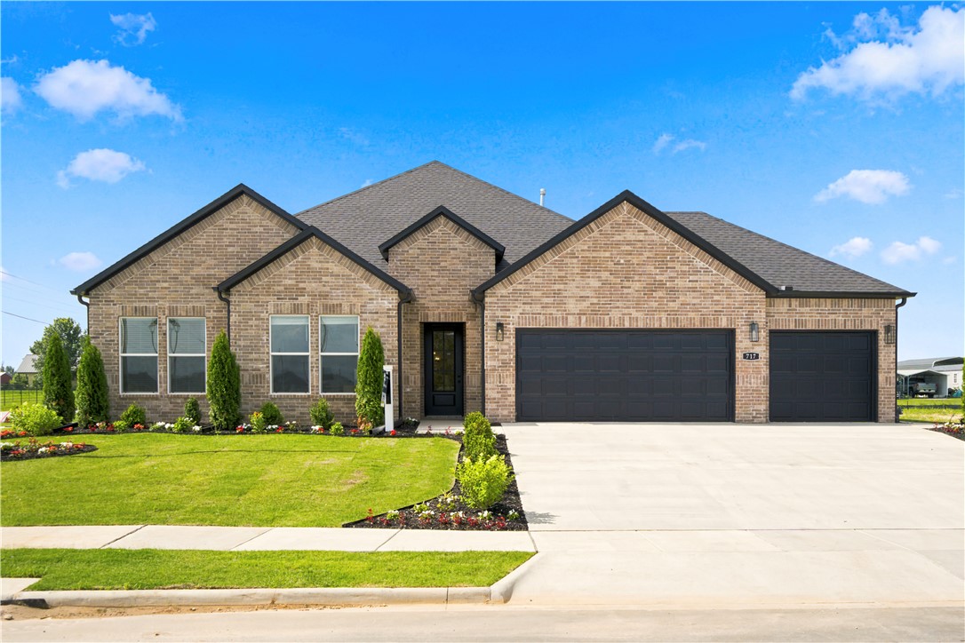 The Holden Floorplan in Renley Rae in Springdale, AR! This plan offers 4 bedrooms and 3 bathrooms with a separate office space! Single-story homes feature engineered wood flooring throughout and tile flooring in the primary bathroom. The kitchen features quartz countertops, 42’’ cabinets, black hardware, and a gas range. The living room features a beautiful modern fireplace with a poplar mantle! Fans are included in all bedrooms and the living room! The primary ensuite will have a walk-in shower, separate tub, and quartz countertops! The exterior of these homes will have 4-sides brick with siding (per plan) and a 3-car garage! Each home will have a lovely covered back patio. Taxes, HOA, and parcel TBD. Home is located in Tontitown/Springdale.