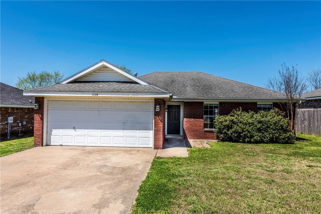 Great first time buyer home or investment property! All brick 3BD/2BA home featuring 2 car garage, landscaped front, vaulted ceilings in living room, gas log fireplace, eat in kitchen w/ patio access, tile throughout, tile backsplash, lots of cabinetry, natural light, large bedrooms, utility room, large backyard w/ patio. Close to University of Arkansas!