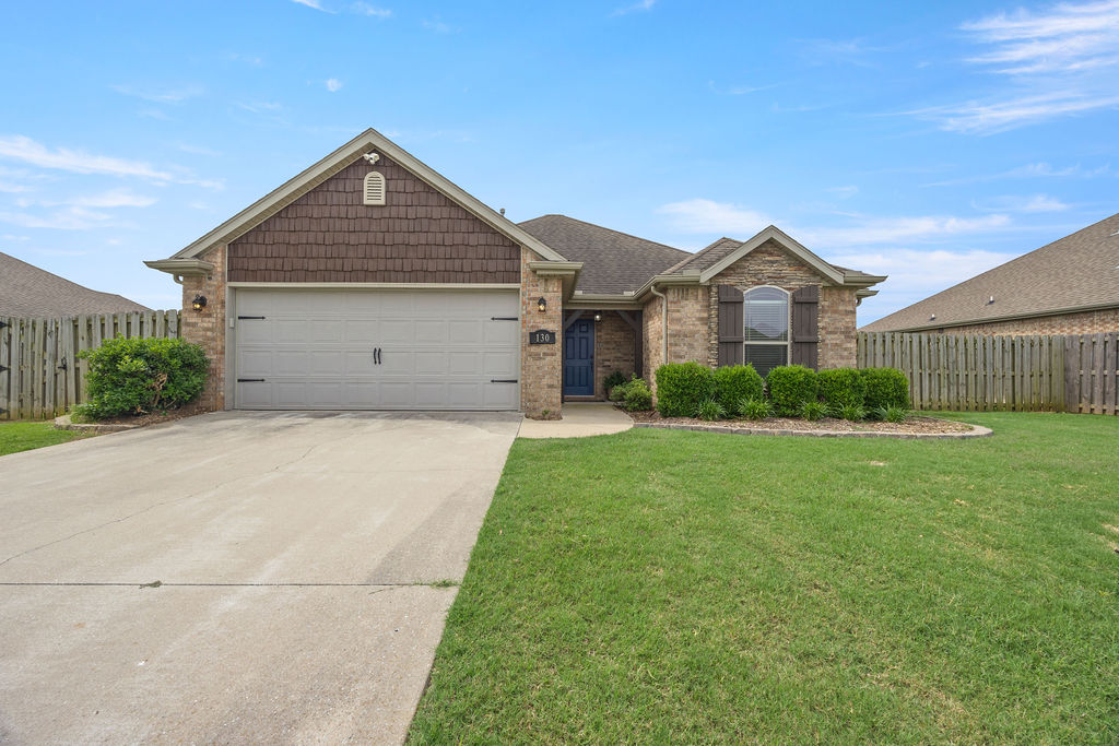 Welcome home to this beautifully maintained Centerton gem offering the perfect blend of comfort, style, and convenience. Featuring a desirable split-floor plan with 3 spacious bedrooms and 2 full baths, this home is designed for both everyday living and effortless entertaining. The inviting living room showcases soaring ceilings, rich wood flooring, and a cozy fireplace, while the kitchen offers granite countertops, ample cabinetry, and a functional layout for gathering with family and friends. Retreat to the spacious primary suite complete with a whirlpool tub, separate shower, and dual walk-in closets. Step outside to enjoy the large fenced backyard with a partially covered patio—ideal for relaxing evenings, pets, play, or weekend BBQs. Located in a quiet neighborhood just minutes from Bentonville schools, shopping, dining, parks and splash pad. This home offers the convenience buyers are looking for with the charm they’ll love. Fridge conveys and bedroom furniture available for purchase.