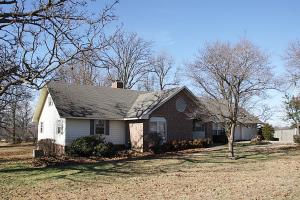 Great location! Close to city but country feeling. Spacious 3BR/2BA home. Large living & dining area, wood burning fireplace, hardwood floors, large partial covered deck, 16x10 storage room off garage plus a 21x12 area over garage, if finished would be a perfect man cave!