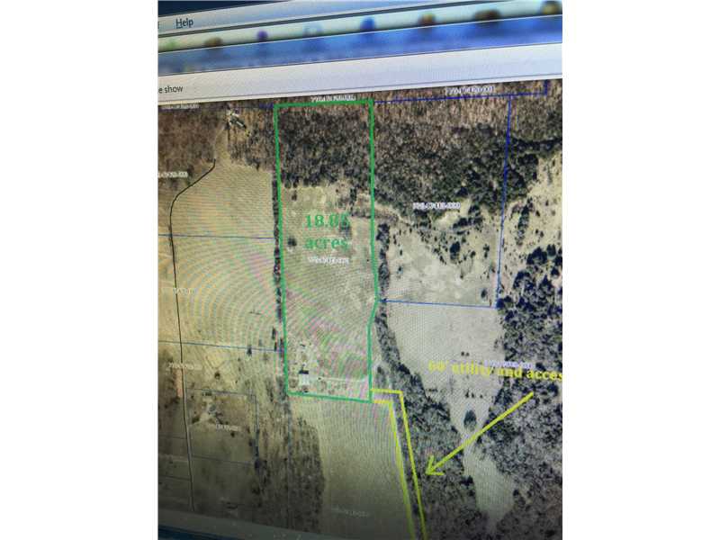Beautiful but close acreage. 10.84 acres. Electric & water at building. Some owner financing or trade possible.  Agent owned.