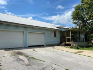 COUNTRY LIVING on a paved road, includes 5.77 acres with a, pole barn, 30x30 shop building, 3 bedroom, 2 bath home only ten minutes from town.  Located southwest of Harrison, ( on the Hwy 43 S to the canoe & kayak  put-in at Boxley,  to float the Buffalo River & see the elk).   Property is only 8/10th mile from the look out on Hwy 43 S.  The house features updates with tin accents, stainless appliances, open concept living, covered front porch and back deck to enjoy the peaceful country with no visible neighbors.  There is a pole barn within steps to enjoy wildlife or potting shed or whatever you like.  The shop is ready to  go with electric and water.    Don't miss this one.