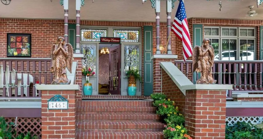 Victorian Grandeur Meets Refined Luxury. Timeless elegance, distinguished AAA Four-Diamond estate inspired by the grandeur of an 1880s Victorian mansion. Set amidst lush, manicured grounds in the heart of Eureka Springs, this exceptional property blends historic charm with elevated modern comfort. A sweeping wrap-around porch welcomes guests into interiors rich with stained glass, antique furnishings, and bespoke architectural detail. Each private suite is thoughtfully appointed with luxury linens, spa-like baths, and indulgent in-room jacuzzis, creating an atmosphere of quiet sophistication and relaxation. Renowned for its gracious hospitality, the property features a gourmet breakfast experience crafted daily with fresh, high-quality ingredients. Ideal for romantic escapes, intimate gatherings, or milestone celebrations, The Hall offers a setting that is both elegant and unforgettable. With a separate owners' residence, it is a legacy property offering refined living, distinctive character, and enduring appeal.
