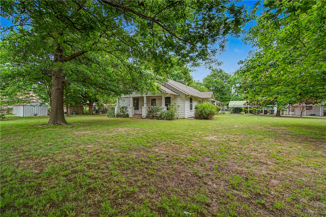 A rare opportunity awaits with this 1.22-acre property on a well-traveled street within Springdale city limits. Built in 1935, with the same owner occupant for 51 years, this home offers the opportunity to live in the existing home while exploring future possibilities. New roof in 2025. Improvements include a detached shop with power, two outbuildings, pump house w/storage and a cellar. All situated on one SF-2 zoned parcel (see attached zoning "cheat sheet" provided by the City describing potential permitted uses). Buyers may wish to explore subdividing, rezoning, home-based business use, or other potential opportunities, subject to applicable approvals and regulations. An additional dwelling may be possible subject to zoning, setbacks, utilities, and all City requirements. Buyer to independently verify all intended uses. Property sold AS IS; seller will make no repairs.