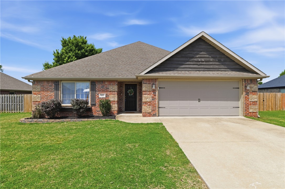 Welcome to 1021 Sienna Dr in Centerton, Arkansas! This all brick home features four spacious bedrooms and two bathrooms, perfect for growing families. The open-concept living area is great for entertaining guests. Step outside to a shaded back porch, ideal for relaxation with  tool shed. The POA offers a clubhouse, gym & pool, along with a playground for the kids. Enjoy near by access to scenic bike trails and splash pad, perfect for outdoor enthusiasts and family. Conveniently located you’ll find a variety of shopping and dining options just a short drive away. The location offers a wonderful blend of comfort and community, making it an ideal place to call home. This home has been meticulously maintained with: all new HVAC (Nest controlled) installed in July 2025, additional attic insulation for proper temperature control July 2025, New water heater June 2025, New WiFi garage door motor May 2026, fresh paint and new carpet May 2026, 220V in garage for EV.  Don’t miss this fantastic opportunity!