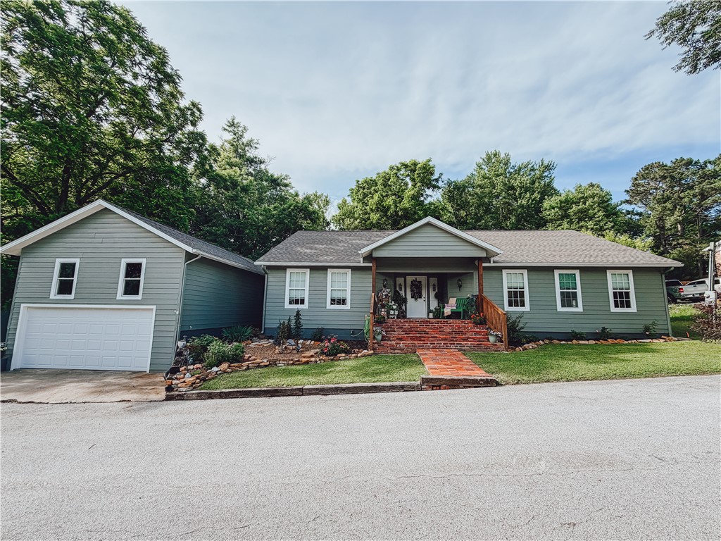 Welcome home to this stunning 2,161 sq. ft. showplace that was completely remodeled in 2024! From the moment you walk in, you’ll love the open-concept design, soaring cathedral ceilings, and the incredible attention to detail throughout. This home is beautifully decorated and feels straight out of a magazine, offering the perfect blend of comfort and style. The spacious living area features a cozy gas log fireplace, creating the ideal spot to relax or entertain.  The master suite is SWEET & offers a peaceful retreat with a walk-in closet and plenty of space to unwind. Step outside and enjoy the beautifully landscaped yard along with covered front and back porches that are perfect for morning coffee or evening gatherings.  Every inch of this home has been thoughtfully updated and designed to impress!  All #s are approximate, age & square footage per assessor.
