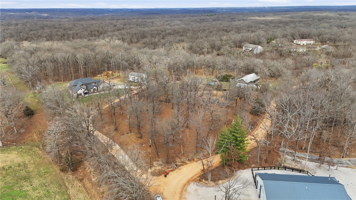 Build Your Dream in the Ozarks – 2 Private Acres in Gravette, AR!
Escape the noise without sacrificing convenience! This beautiful 2-acre property in Gravette, Arkansas offers the perfect balance of privacy and accessibility. Surrounded by nature, you'll enjoy a peaceful, secluded setting with plenty of room to build your dream home.
Despite its quiet location, you're just 20 minutes from Walmart's Corporate Headquarters in Bentonville and only 10–15 minutes from downtown Gravette, giving you quick access to shopping, dining, schools, and everyday essentials.
Property Highlights:
 2 wooded acres with a secluded feel
 Ideal homesite with room to spread out
 Approximately 20 minutes to Walmart Corporate Headquarters
 Just 10–15 minutes to Gravette for groceries, restaurants, and services
 Peaceful country atmosphere with convenient access to Northwest Arkansas
Don't miss your chance to own a slice of Northwest Arkansas where privacy, convenience, and opportunity come together!