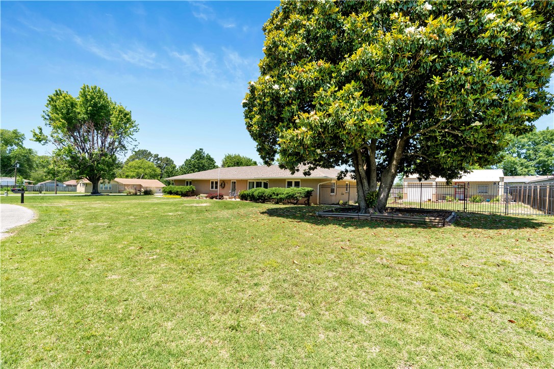A 2 owner home in very nice condition with storage galore. New HVAC in 2021 and new roof in 2024. Large open living area is perfect for entertaining. Split bedroom plan for privacy, sunroom for dining or whatever you choose. This home has been lovingly cared for. Lots of room plus an office. There is a 20 X 30 work shop or extra storage (perfect for arts and crafts or hobbies). You can't beat the location. Close no sooner than July 1st.