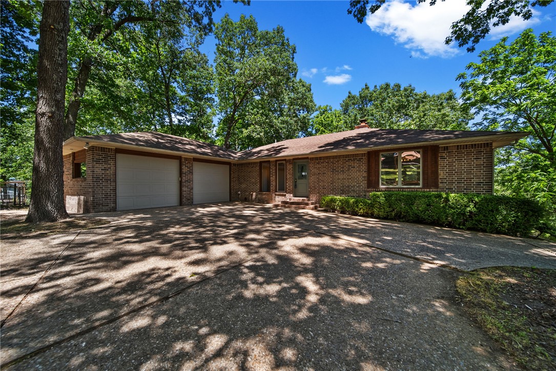 Thoughtfully designed to capture the Lake Front access. This home offers a balance of comfort, space, & lifestyle. Inside, you'll find an open-concept filled with natural light, featuring spacious living and dining areas that flow seamlessly to outdoor entertaining spaces. Kitchen offers ample cabinetry, large island, and an ideal layout. The primary bedroom provides a private escape, sitting area, bath, & walk-in closet. Guest bedroom, and bath are located at the opposite end of the home. Downstairs 2 bedrooms, full bath, and sitting area opening onto a lower deck form a private guest suite with lake views. The large finished utility garage sports a work bench, space for pool/ping pong table, parking for ATV, and generous storage for water toys. A fenced garden, fenced play yard/dog run, and lots of wide open spaces. Direct access to the lake, 10x20 boat slip with lift, PWC platform, & swim deck. Whether you're seeking a full-time residence or a weekend getaway, this property delivers the ultimate lake lifestyle.